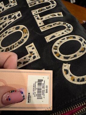 Juicy Couture leopard print duffel with pink inside